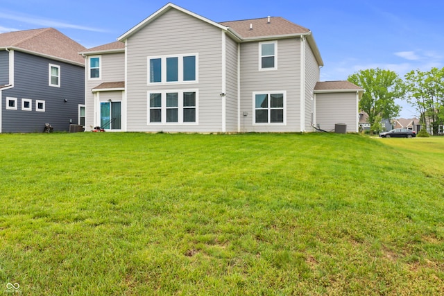 10811 Wild Orchard Ln, Indianapolis, IN 46239 - back of house featuring a yard and a shingled roof