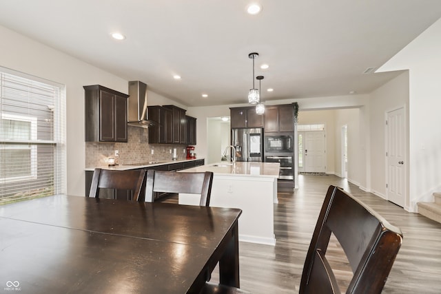 10811 Wild Orchard Ln, Indianapolis, IN 46239 - dining space with wood finished floors, recessed lighting, and stairway