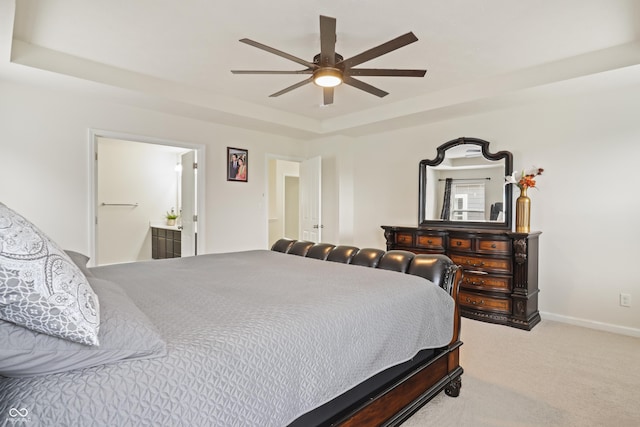 10811 Wild Orchard Ln, Indianapolis, IN 46239 - bedroom with light colored carpet, a raised ceiling, ceiling fan, and ensuite bath