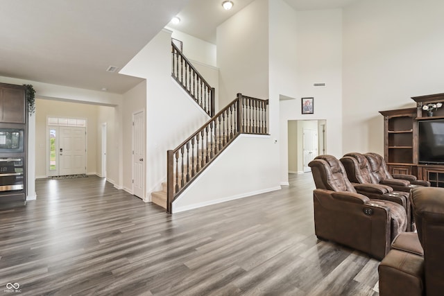 10811 Wild Orchard Ln, Indianapolis, IN 46239 - living room with stairs, dark wood finished floors, and a high ceiling