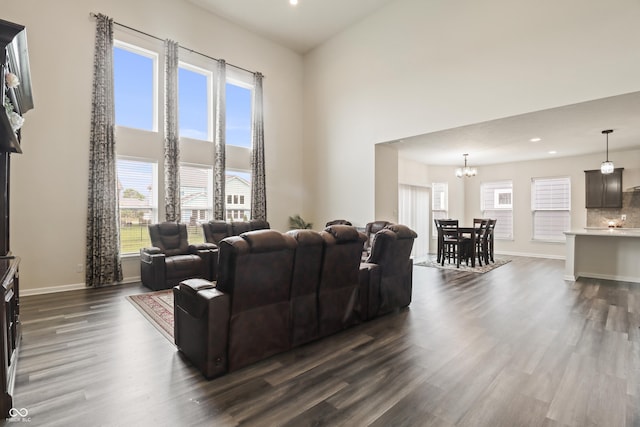 10811 Wild Orchard Ln, Indianapolis, IN 46239 - living area with dark wood-type flooring, a towering ceiling, a chandelier, and recessed lighting