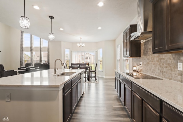 10811 Wild Orchard Ln, Indianapolis, IN 46239 - kitchen with wall chimney exhaust hood, black electric cooktop, tasteful backsplash, dark wood finished floors, and dark brown cabinets