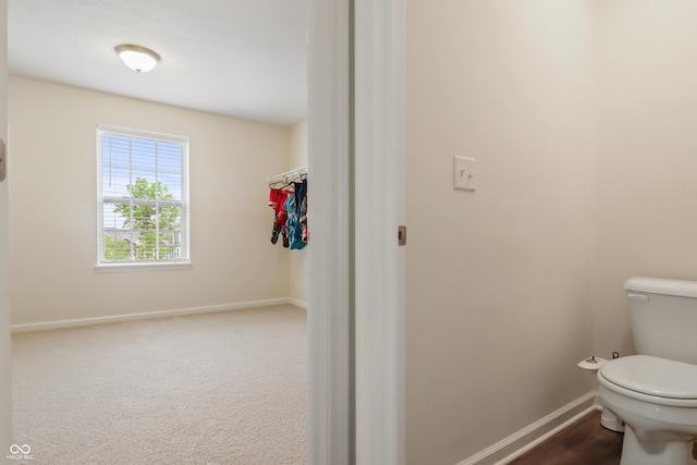 10811 Wild Orchard Ln, Indianapolis, IN 46239 - bathroom with toilet and baseboards