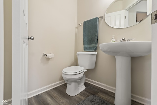 10811 Wild Orchard Ln, Indianapolis, IN 46239 - bathroom with toilet and wood finished floors