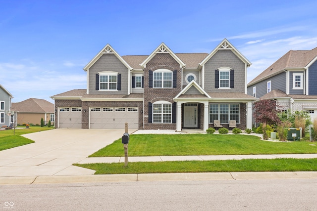 10811 Wild Orchard Ln, Indianapolis, IN 46239 - view of front of house featuring driveway, a front yard, brick siding, a garage, and a shingled roof