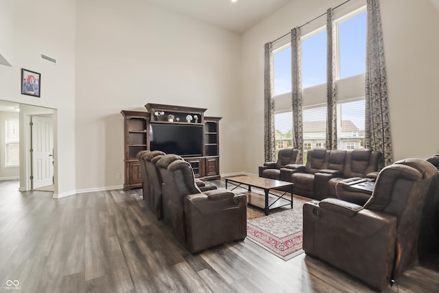 10811 Wild Orchard Ln, Indianapolis, IN 46239 - living room with a towering ceiling, dark wood-style flooring, and healthy amount of natural light