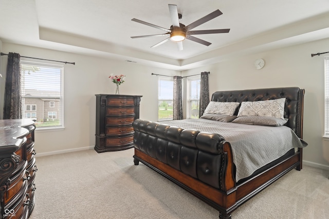 10811 Wild Orchard Ln, Indianapolis, IN 46239 - bedroom with a raised ceiling, light carpet, and a ceiling fan
