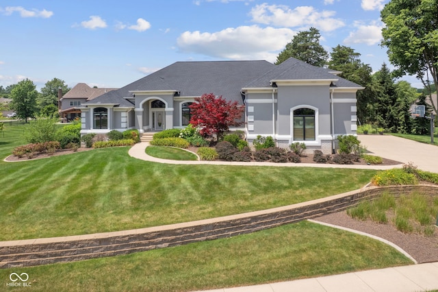 4396 W Eagle Trce, New Palestine, IN 46163 - view of front of property featuring a front lawn, stucco siding, and roof with shingles