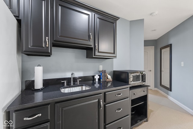 4396 W Eagle Trce, New Palestine, IN 46163 - kitchen with stainless steel microwave, light carpet, and dark stone counters