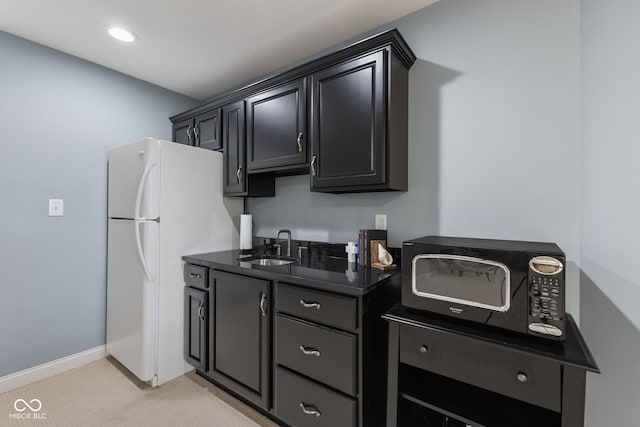 4396 W Eagle Trce, New Palestine, IN 46163 - kitchen with black microwave, freestanding refrigerator, dark cabinets, and recessed lighting