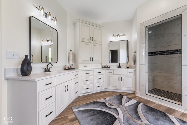 4396 W Eagle Trce, New Palestine, IN 46163 - full bath with double vanity, wood finished floors, and a tile shower