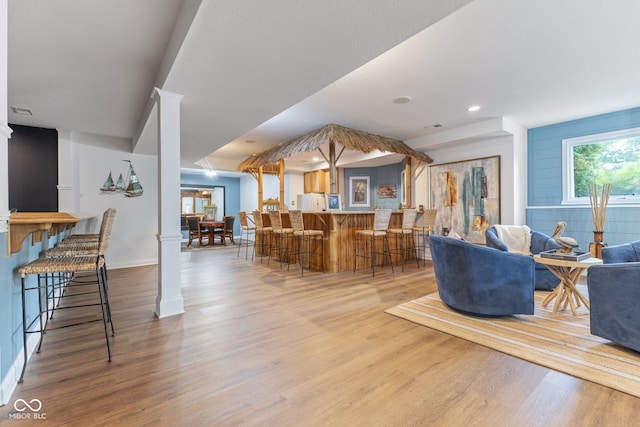 4396 W Eagle Trce, New Palestine, IN 46163 - living area with wood finished floors, recessed lighting, and bar area