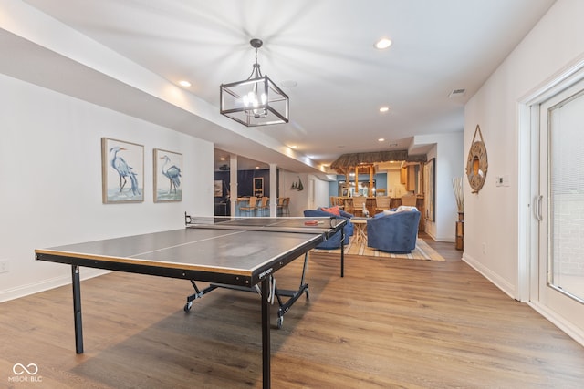 4396 W Eagle Trce, New Palestine, IN 46163 - rec room featuring light wood-style floors, a chandelier, and recessed lighting