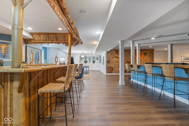 4396 W Eagle Trce, New Palestine, IN 46163 - indoor bar with ornate columns, wood finished floors, and recessed lighting