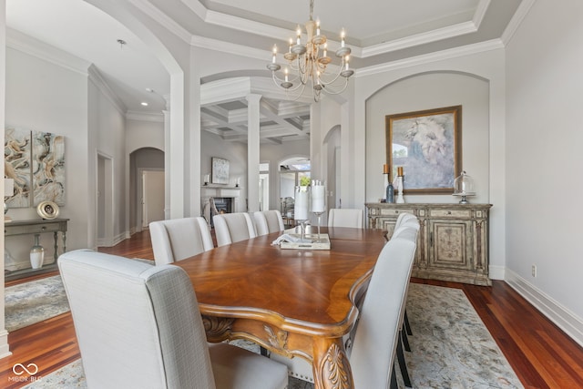 4396 W Eagle Trce, New Palestine, IN 46163 - dining area featuring arched walkways, coffered ceiling, a chandelier, dark wood-style floors, and crown molding