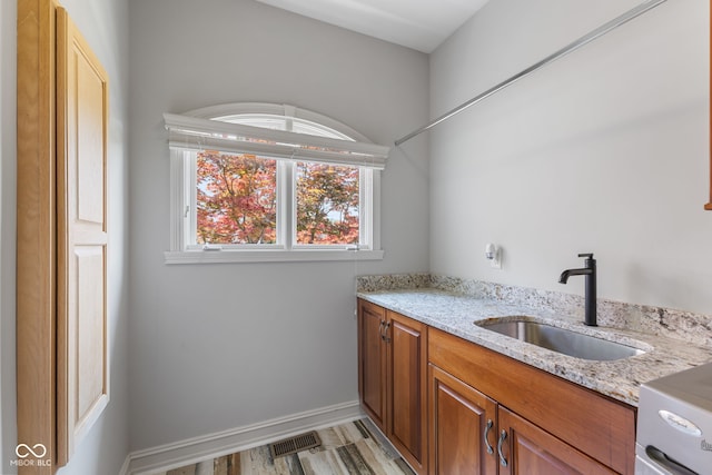 4396 W Eagle Trce, New Palestine, IN 46163 - laundry room with a sink and baseboards