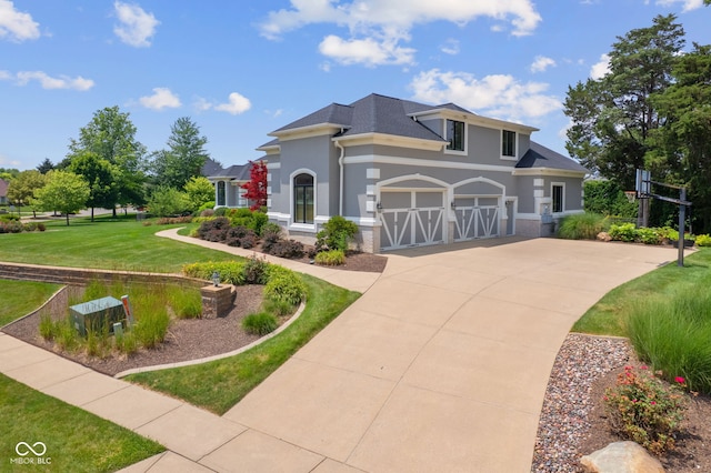 4396 W Eagle Trce, New Palestine, IN 46163 - view of front facade with driveway, a front lawn, and stucco siding