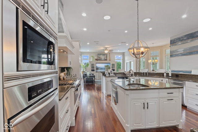 4396 W Eagle Trce, New Palestine, IN 46163 - kitchen with stainless steel appliances, a chandelier, recessed lighting, open floor plan, and a center island with sink