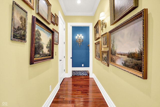11557 Willow Springs Dr, Zionsville, IN 46077 - corridor featuring dark wood finished floors, crown molding, and a chandelier