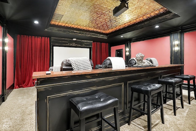 11557 Willow Springs Dr, Zionsville, IN 46077 - home theater room with light carpet, an ornate ceiling, and a raised ceiling