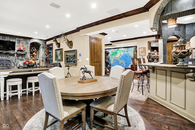 11557 Willow Springs Dr, Zionsville, IN 46077 - dining space featuring ornamental molding, wood finished floors, recessed lighting, and decorative columns