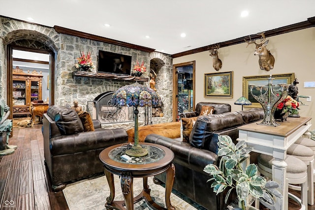 11557 Willow Springs Dr, Zionsville, IN 46077 - living area featuring crown molding, a fireplace, wood-type flooring, and recessed lighting