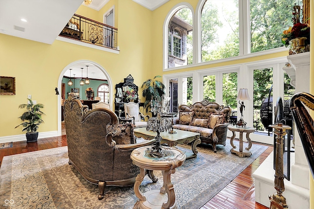 11557 Willow Springs Dr, Zionsville, IN 46077 - living area with a towering ceiling, wood finished floors, and crown molding