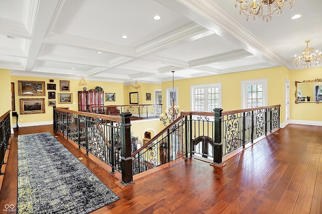 11557 Willow Springs Dr, Zionsville, IN 46077 - corridor with a chandelier, an upstairs landing, coffered ceiling, beamed ceiling, and wood finished floors