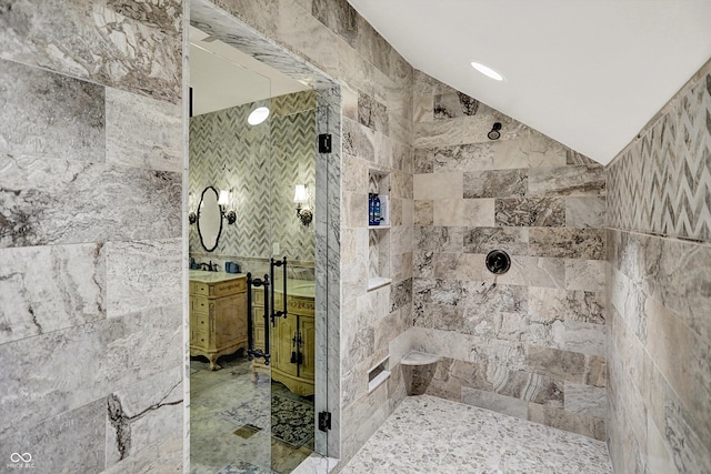 11557 Willow Springs Dr, Zionsville, IN 46077 - full bathroom with tile walls, tiled shower, vanity, and marble finish flooring