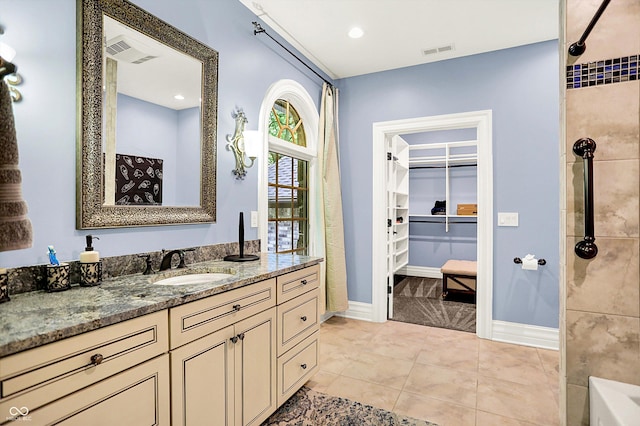 11557 Willow Springs Dr, Zionsville, IN 46077 - bathroom with vanity, a tile shower, a walk in closet, and a bathtub