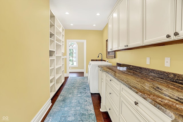 11557 Willow Springs Dr, Zionsville, IN 46077 - washroom featuring cabinet space, dark wood-style floors, washing machine and dryer, and recessed lighting