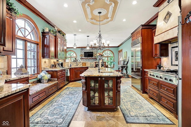 11557 Willow Springs Dr, Zionsville, IN 46077 - kitchen with stainless steel appliances, crown molding, decorative backsplash, recessed lighting, and custom range hood