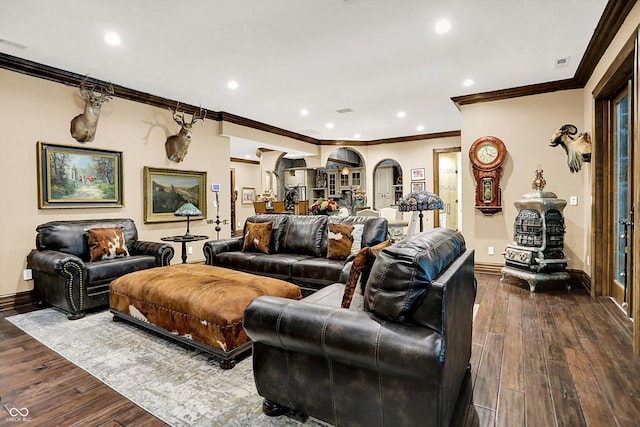 11557 Willow Springs Dr, Zionsville, IN 46077 - living area with ornamental molding, dark wood-style floors, arched walkways, and recessed lighting