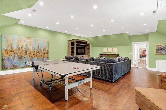11557 Willow Springs Dr, Zionsville, IN 46077 - recreation room featuring a fireplace, wood-type flooring, recessed lighting, and vaulted ceiling