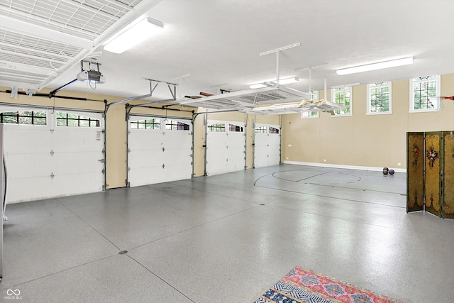 11557 Willow Springs Dr, Zionsville, IN 46077 - garage featuring a garage door opener and baseboards