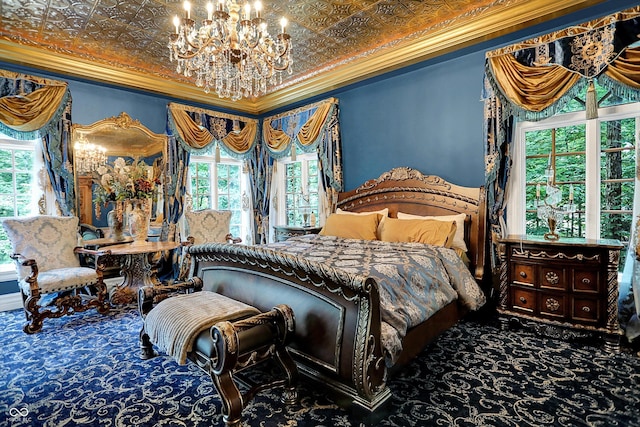 11557 Willow Springs Dr, Zionsville, IN 46077 - bedroom featuring ornamental molding, a chandelier, carpet flooring, multiple windows, and an ornate ceiling