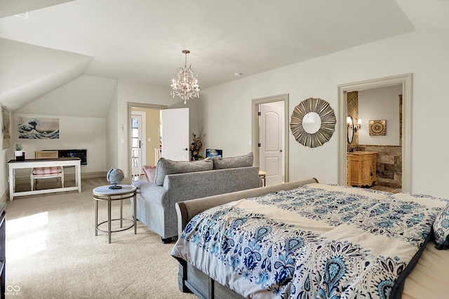 11557 Willow Springs Dr, Zionsville, IN 46077 - carpeted bedroom with a chandelier, lofted ceiling, and ensuite bathroom