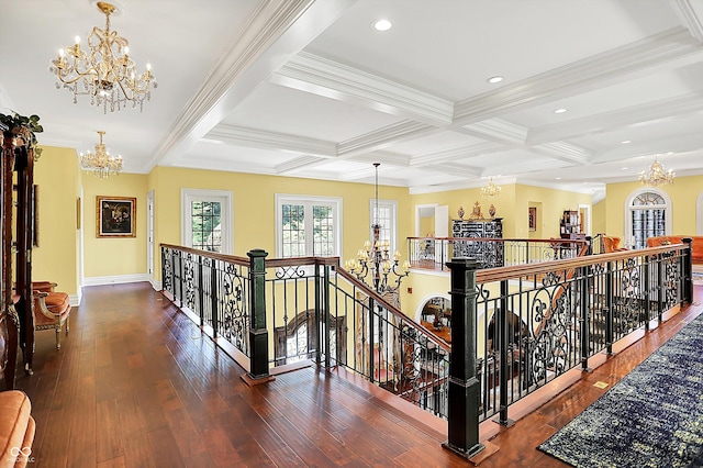11557 Willow Springs Dr, Zionsville, IN 46077 - hall with a chandelier, an upstairs landing, beamed ceiling, wood finished floors, and coffered ceiling