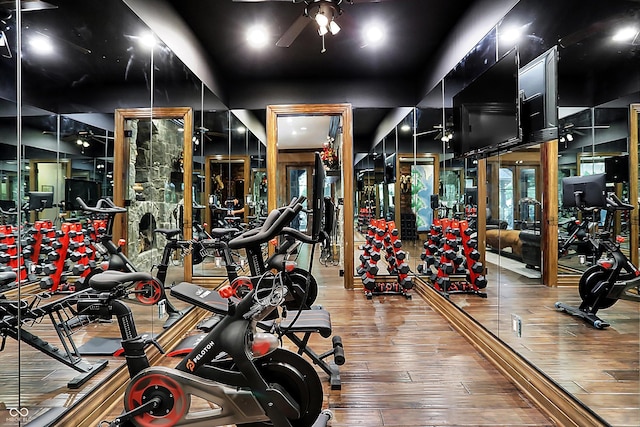 11557 Willow Springs Dr, Zionsville, IN 46077 - exercise room featuring a ceiling fan and wood-type flooring