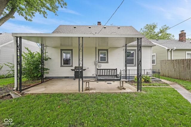 1739 Caldwell Pl, Columbus, IN 47201 - back of house featuring a patio, a shingled roof, and crawl space