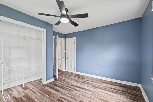 1739 Caldwell Pl, Columbus, IN 47201 - unfurnished bedroom featuring a closet, wood finished floors, and ceiling fan