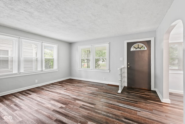 1739 Caldwell Pl, Columbus, IN 47201 - entrance foyer with a textured ceiling, wood finished floors, and arched walkways