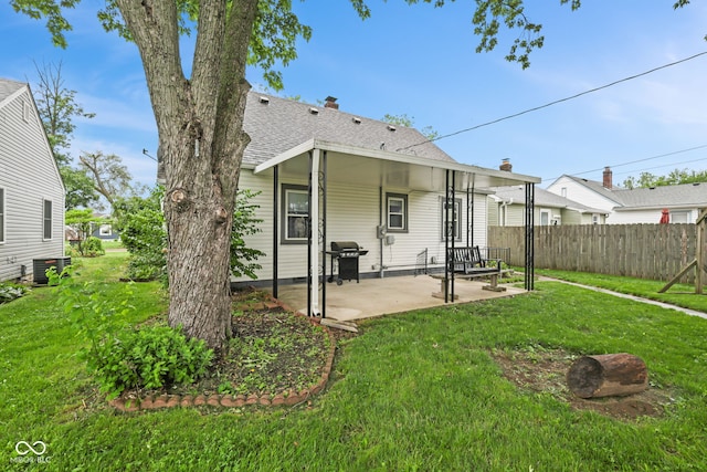 1739 Caldwell Pl, Columbus, IN 47201 - back of house with a patio area and a shingled roof