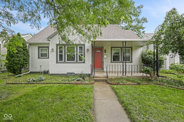 1739 Caldwell Pl, Columbus, IN 47201 - bungalow-style house featuring a porch, a front lawn, and a shingled roof