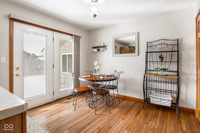 2872 N Prairie Stream Way, Columbus, IN 47203 - dining room with light wood-style flooring and baseboards