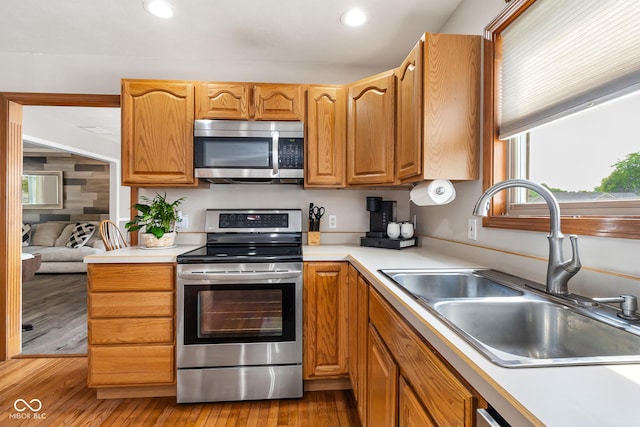 2872 N Prairie Stream Way, Columbus, IN 47203 - kitchen featuring stainless steel appliances, light countertops, light wood finished floors, and recessed lighting