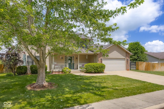 2872 N Prairie Stream Way, Columbus, IN 47203 - view of front of home with driveway, a porch, an attached garage, and brick siding