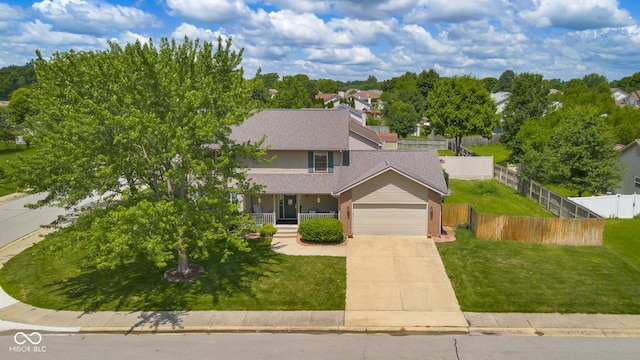2872 N Prairie Stream Way, Columbus, IN 47203 - traditional-style home featuring brick siding, an attached garage, concrete driveway, covered porch, and a shingled roof