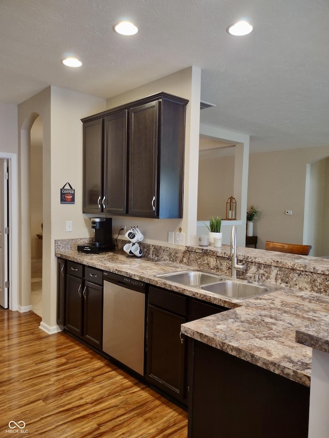 5932 Edelle Dr, Indianapolis, IN 46237 - kitchen featuring dishwasher, dark brown cabinetry, light wood-type flooring, arched walkways, and recessed lighting
