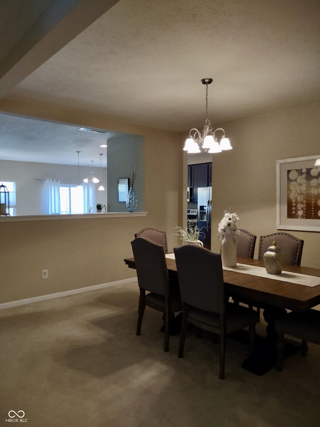 5932 Edelle Dr, Indianapolis, IN 46237 - carpeted dining space with a chandelier and baseboards